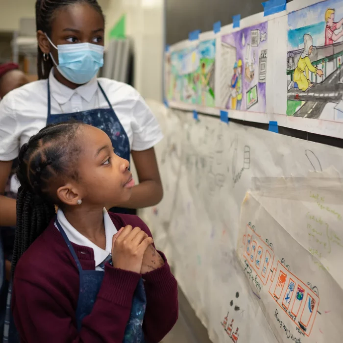 Students working on a mural